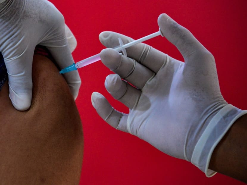 A health worker administers the Covid-19 coronavirus Sinovac vaccine at the Zainoel Abidin hospital in Banda Aceh on May 20, 2021.