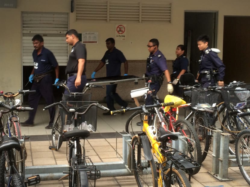 Authorities carrying out the dead newborn baby that was found in a Tampines MRT station toilet on Friday afternoon (June 3). Photo: Jason Quah/TODAY
