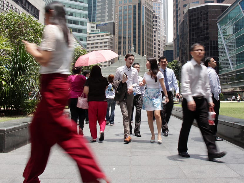 A typical afternoon at Raffles Place. Professionals, managers and executives (PMEs). Employment. Manpower.Photo: Low Wei Xin