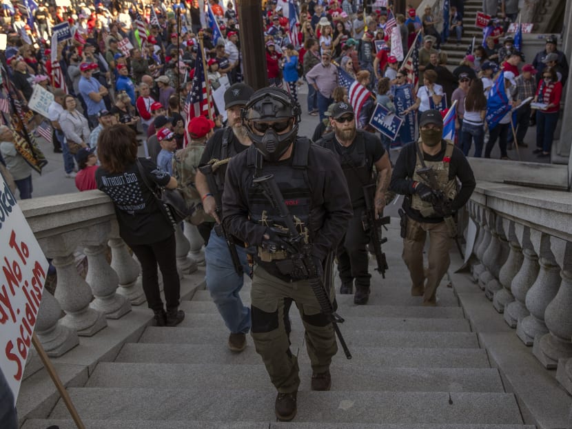 Armed supporters of President Trump join in a protest rally at the Pennsylvania State Capitol in Harrisburg as they react to the news that Joe Biden was elected president on Nov 7, 2020.