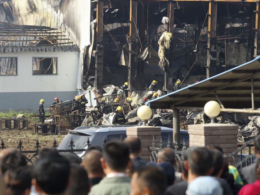Gallery: China farm fire: Relatives scuffle with police, demand answers