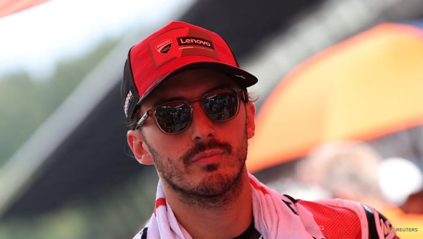 Bagnaia smashes lap record to storm to pole at Japanese MotoGP