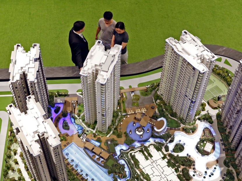 Prospective buyers at a condominium showroom. TODAY file photo