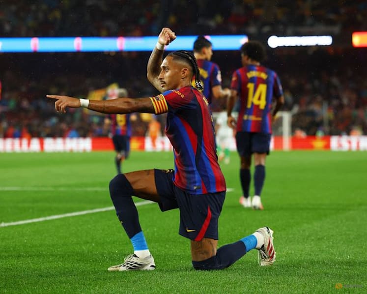 Flick sets record as Barcelona breeze past Racing with Raphinha hat-trick