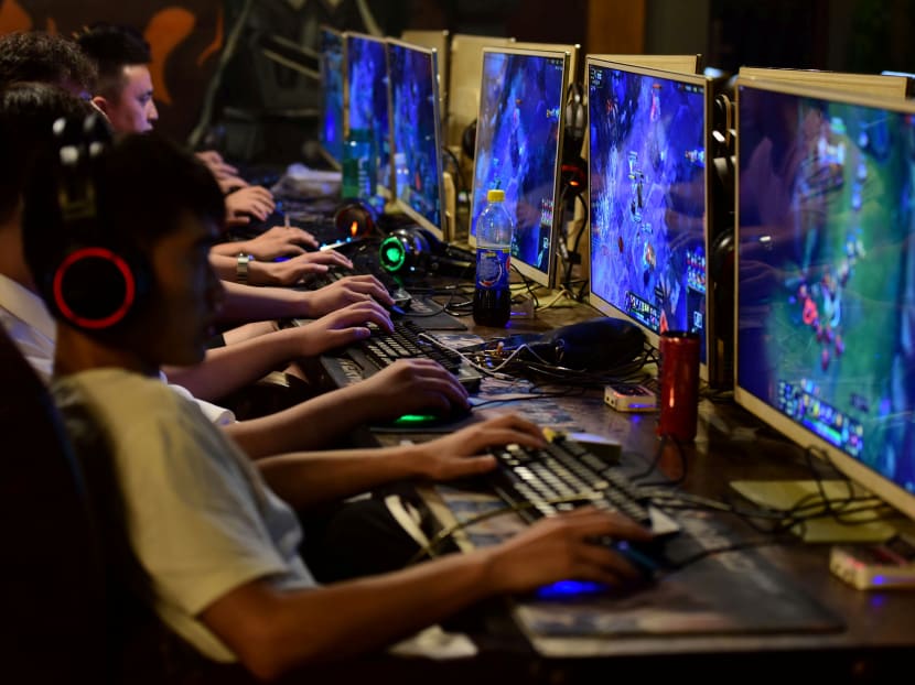 People play online games at an internet cafe in Fuyang, Anhui province, China on Aug 20, 2018.
