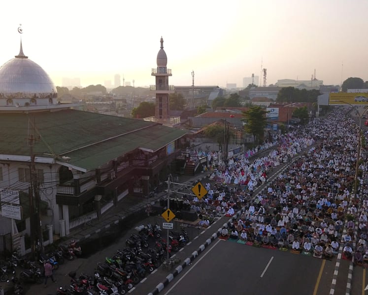 Muslims mark Eid al-Fitr holiday with joy, worry