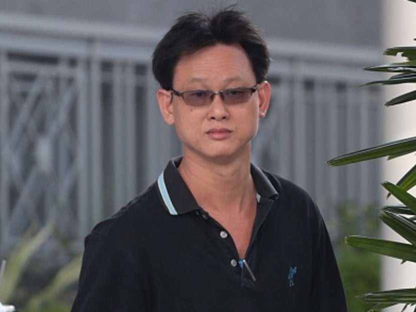 49-year-old Neo Gim Huah arriving at court earlier this morning. Photo: Jason Quah/TODAY