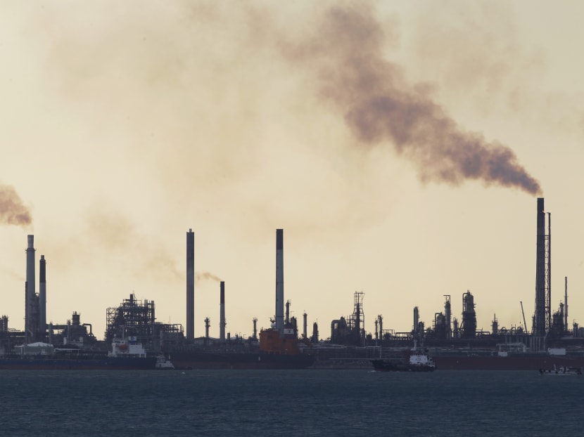Lightning flashes across the night sky above the Central Expressway. Singapore is working on a long-term low carbon emissions strategy to counter the worsening effects of climate change already being experienced today.