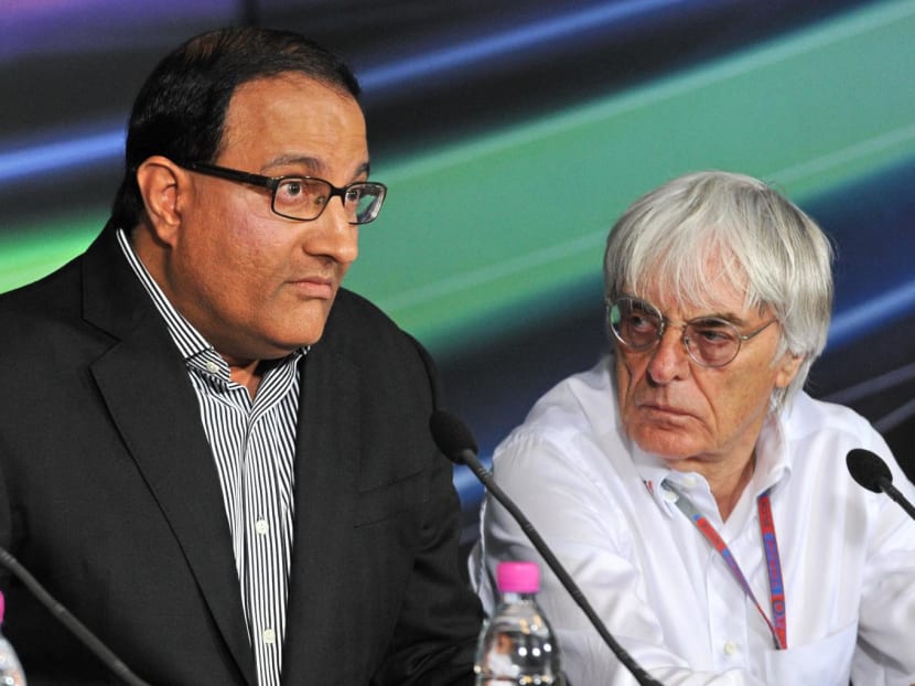 Singapore minister of trade and industry S Iswaran (L) speaks while Formula One rights-holder Bernie Ecclestone (R) looks on during a press conference at Formula One's Singapore Grand Prix night race in Singapore on Sept 22, 2012. Singapore minister of trade and industry S Iswaran (L) speaks while Formula One rights-holder Bernie Ecclestone (R) looks on during a press conference at Formula One's Singapore Grand Prix night race in Singapore on Sept 22, 2012.