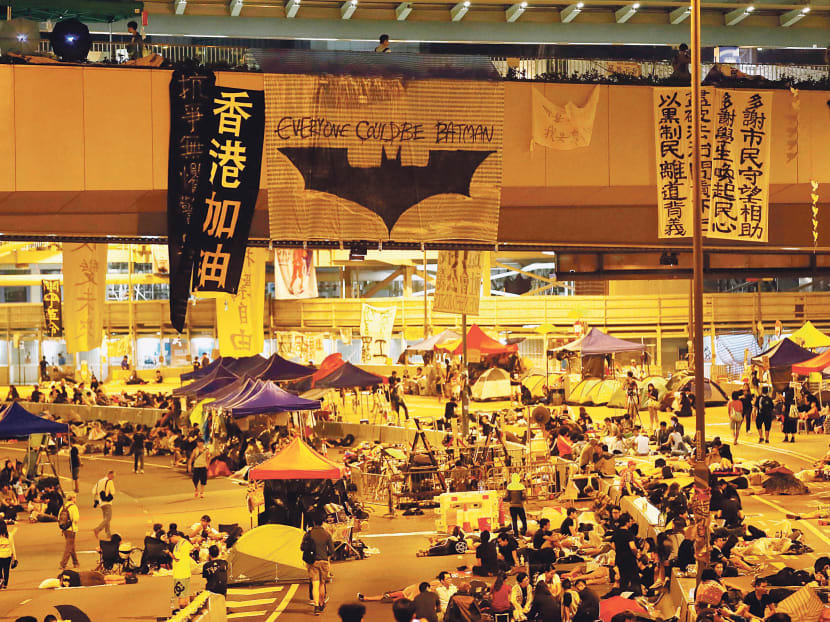 The protests should be about how Beijing ensures that Hong Kong’s problems are competently addressed by the next Chief Executive. Photo: EPA