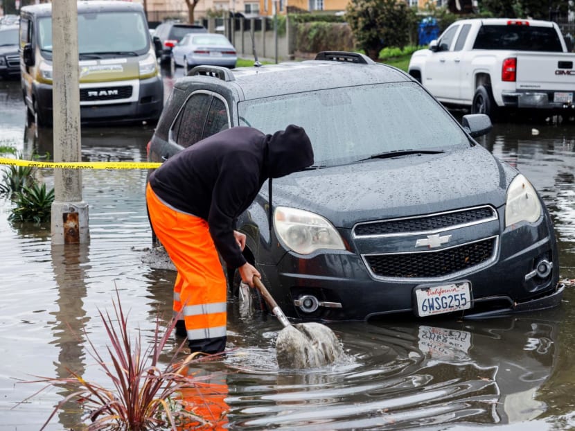 A person works to drain the gutter, in Harbor City, Los Angeles, California, US on Feb 1, 2024. A person works to drain the gutter, in Harbor City, Los Angeles, California, US on Feb 1, 2024.