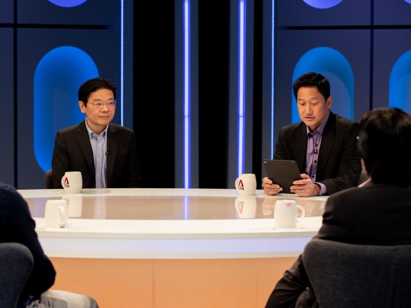 Deputy Prime Minister and Finance Minister Lawrence Wong (left) addressed some questions regarding the national budget in a televised programme.