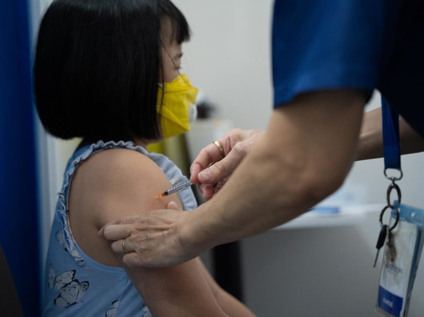A&nbsp;child&nbsp;receiving the Covid-19&nbsp;vaccine&nbsp;at Our Tampines Hub&nbsp;vaccination&nbsp;centre on Jan 12, 2022.