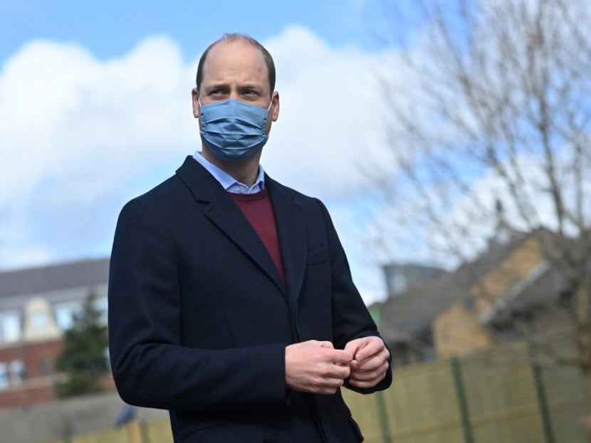 Britain's Prince William, Duke of Cambridge reacts to a question from the media as he leaves after a visit to School21 following its re-opening after the easing of coronavirus lockdown restrictions in east London on March 11, 2021.