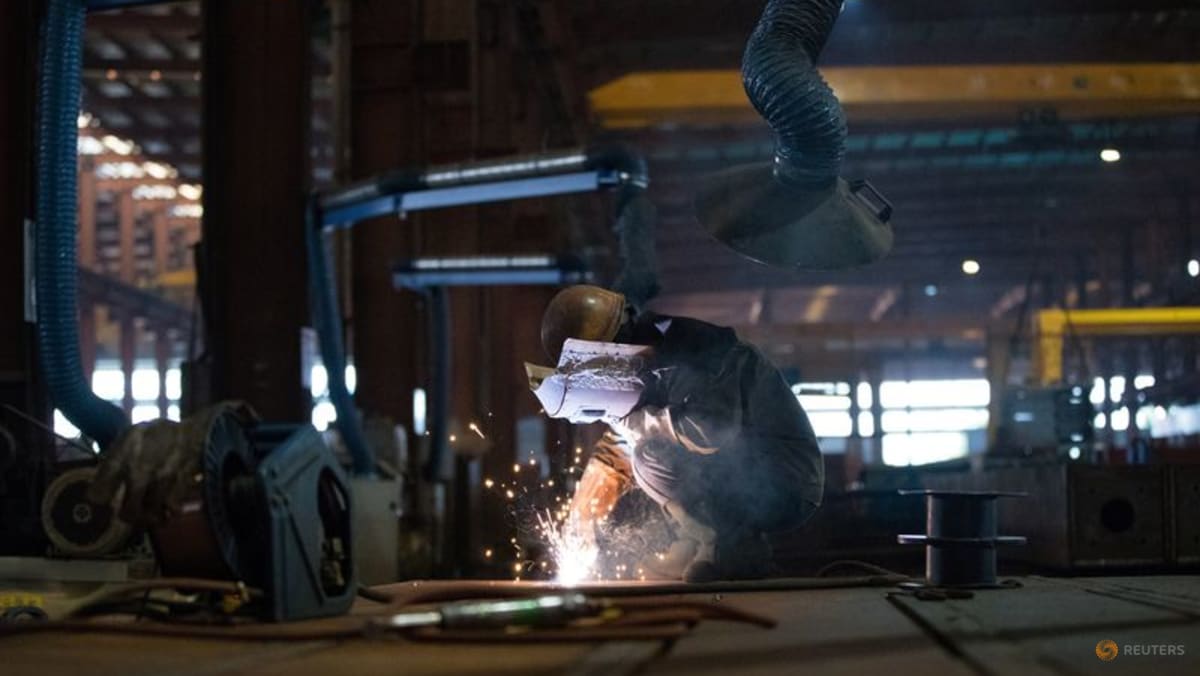 China's factory activity returns to growth in December, ending eight months of decline