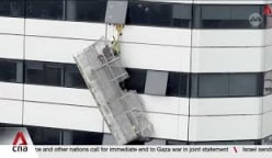 2 workers rescued after being trapped on gondola over 20 storeys high outside Raffles City Tower 
