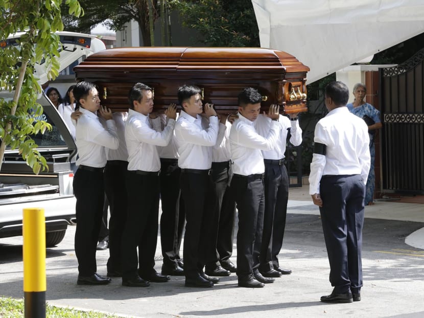 The body of Mr S R Nathan being carried into his family home on Tuesday morning (Aug 23). Photo: Wee Teck Hian/TODAY