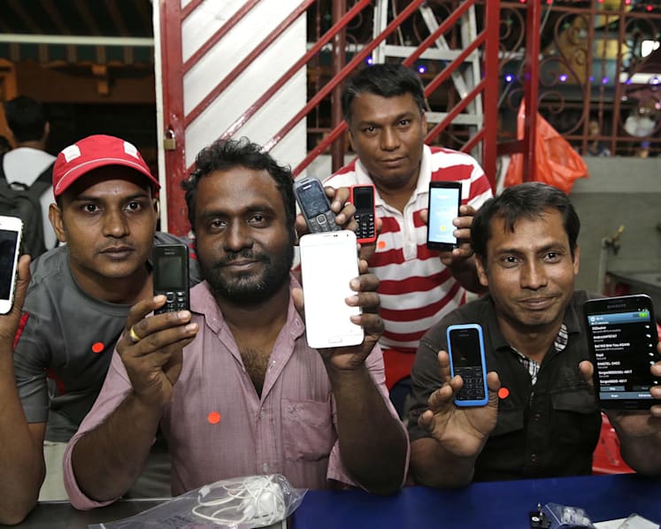 450 needy foreign workers set to get new phones ahead of 3G shift