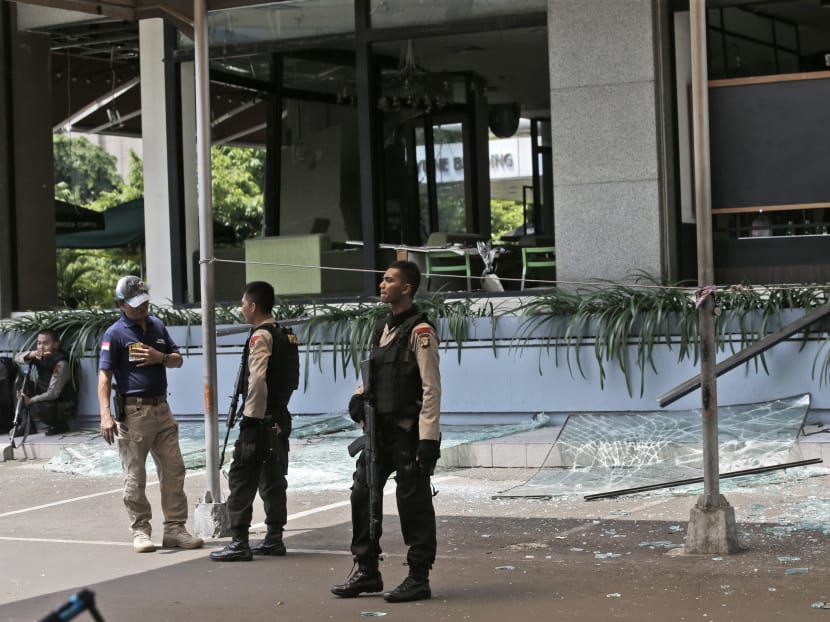 Seven dead in Jakarta blasts, gunfight