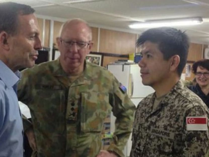 Director of Joint Operations Brigadier General Chia Choon Hoong (right) with Australia’s Prime Minister Tony Abbott (left) and Chief of the Defence Force General David John Hurley during a recognition ceremony at Multinational Base - Tarin Kowt in Oruzgan, Afghanistan. Photo: MINDEF