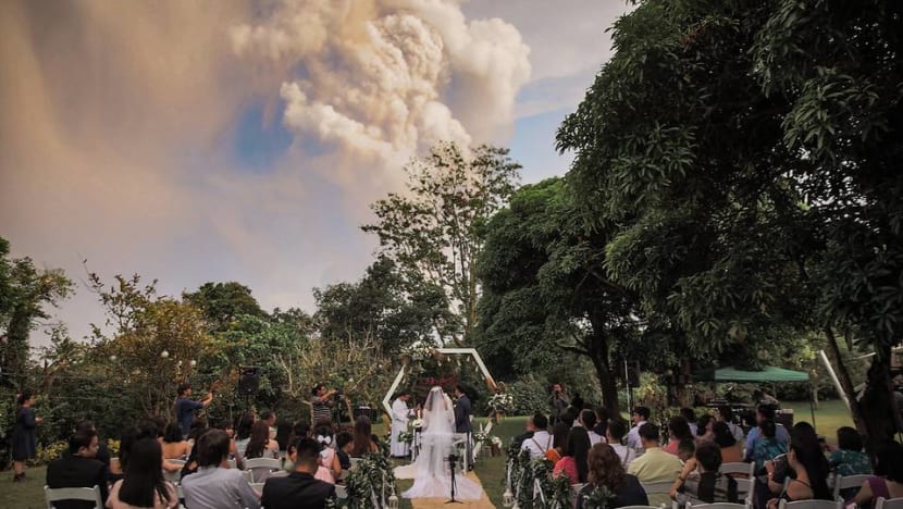 Filipino couple hold wedding amid 'light rain of ash' from Taal volcano