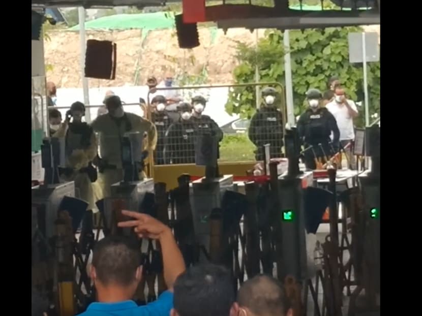 A screengrab of a video purportedly showing riot police deployed at Westlite Jalan Tukang dormitory on Oct 13, 2021. A screengrab of a video purportedly showing riot police deployed at Westlite Jalan Tukang dormitory on Oct 13, 2021.