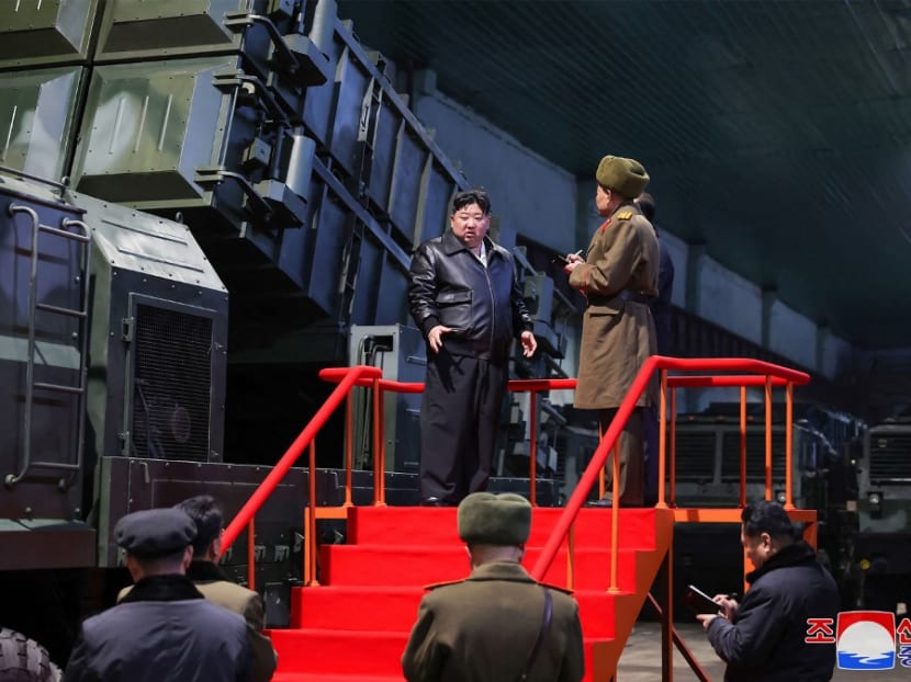 This undated picture taken by North Korea's official Korean Central News Agency (KCNA) and released on January 10, 2024 shows North Korean leader Kim Jong Un (L) inspecting a major munitions factory to learn about the production of weapons and equipment at an undisclosed location in North Korea.