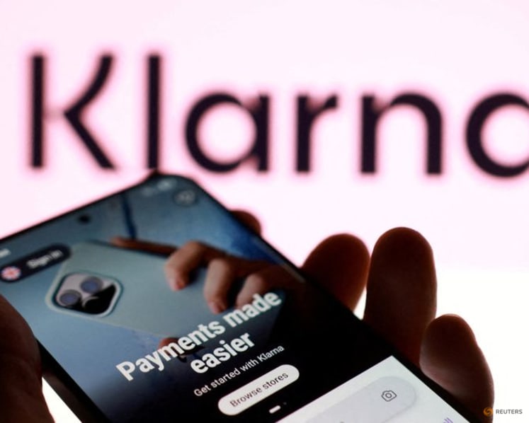 Sweden's Klarna swings to loss as fast growth hikes costs, shares fall 23%