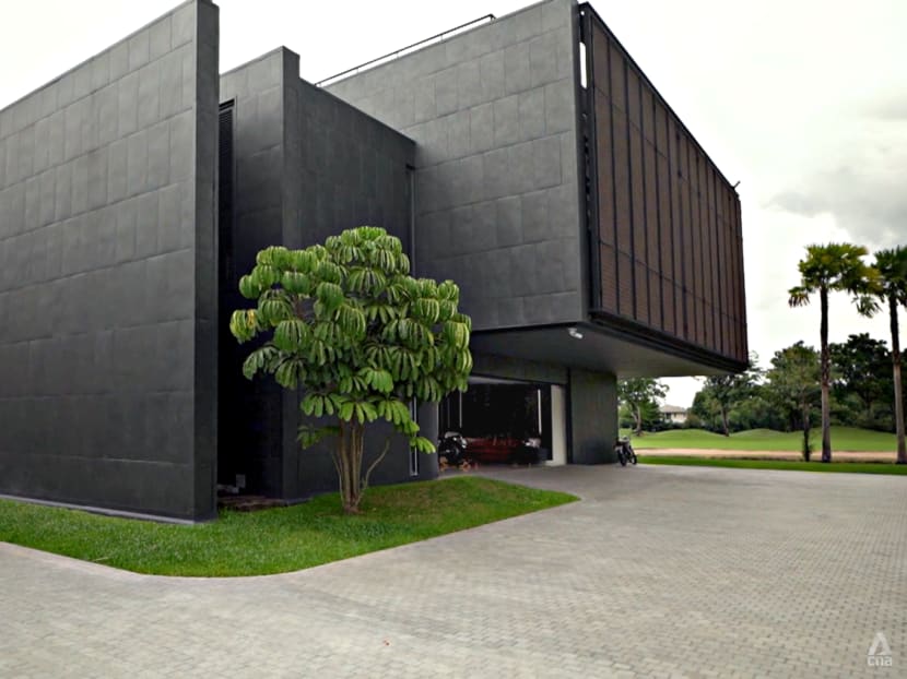 A structure built to look like an impenetrable bunker is actually home to a multigenerational Thai family A structure built to look like an impenetrable bunker is actually home to a multigenerational Thai family