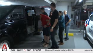 Indonesian accused of murdering his wife in Singapore hotel brought back to crime scene