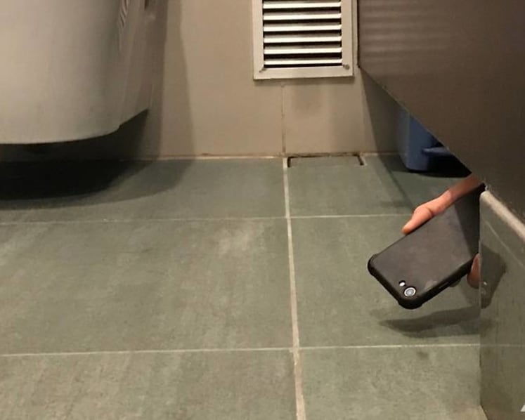Toilet voyeur caught in the act by victim's colleague gets jail