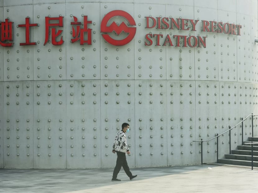 A resident walks past the Disney Resort subway station in Shanghai on Nov 1, 2021 as Shanghai Disneyland and Disneytown is closed from Nov 1 to 2 for measures against the spread of the Covid-19 coronavirus.