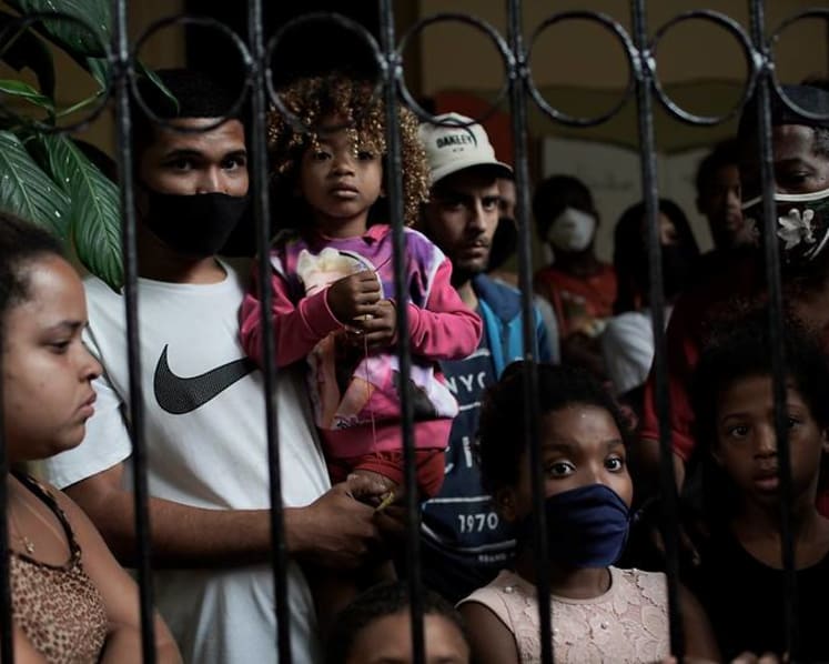 Brazil’s poor squeezed by less virus aid, surging food costs