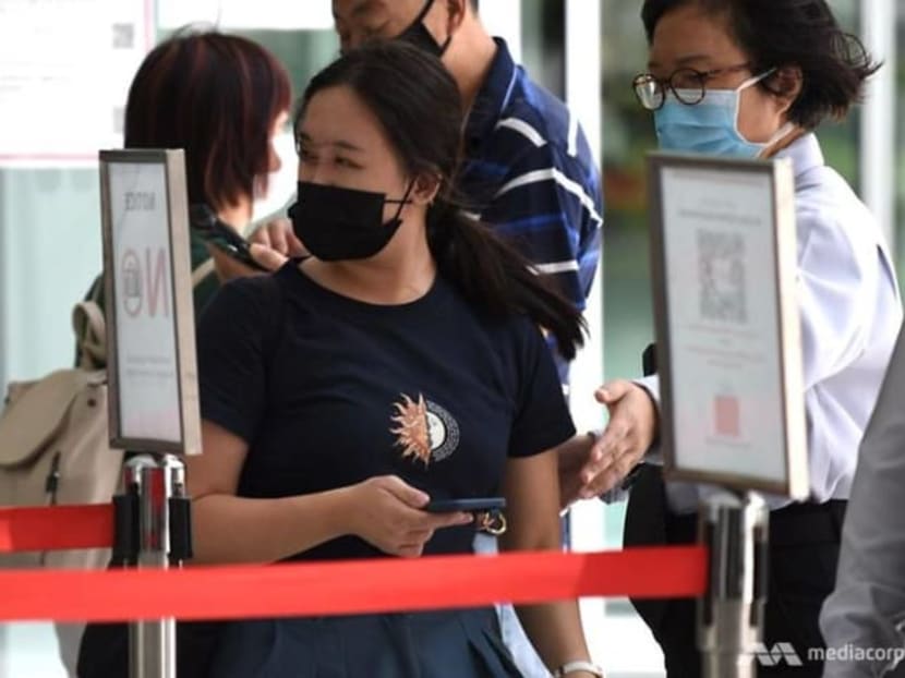 Esther Tan Ling Ying arriving at the State Courts on March 9, 2021. Photo: CNA