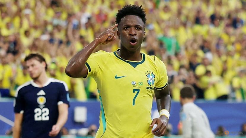 Vinicius fires Brazil into World Cup knockouts with 3-0 win over Scotland