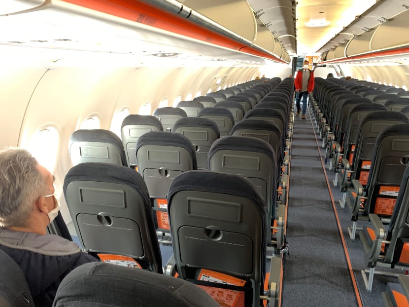 Passengers board an Easyjet domestic flight at an airport in the United Kingdom on June 15, 2020 as the low cost carrier resumes flights for the first time since the March coronavirus lockdown.