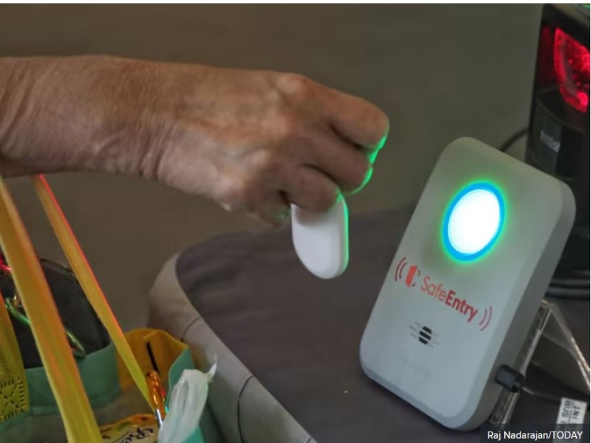 File photo of a TraceTogether contact tracing token being used.