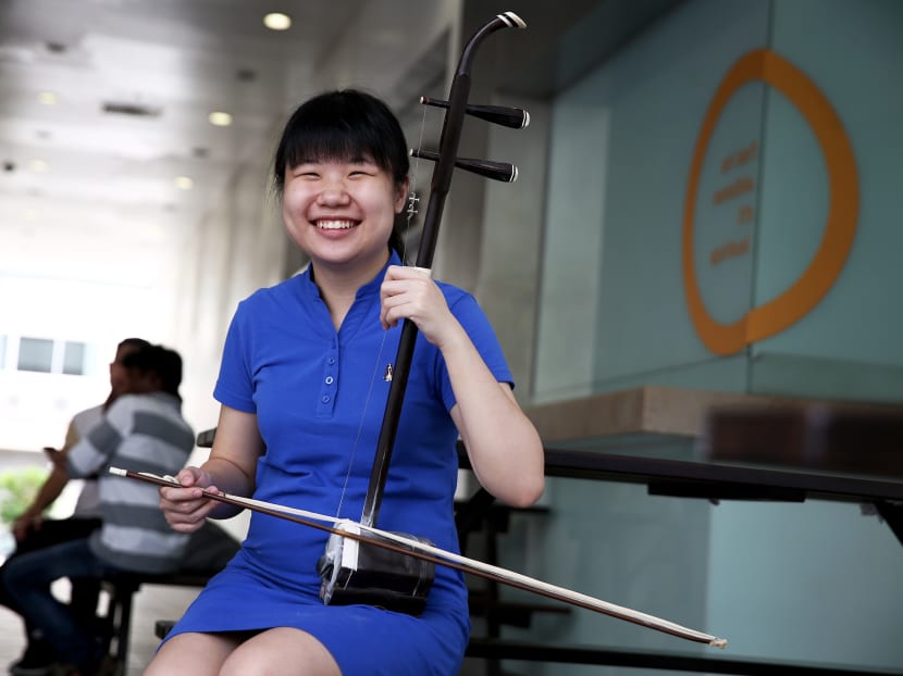 Ms Stephanie Ow, 21, does not rely on musical scors to play her erhu. Instead, she familiarises herself with where to place her fingers and listens to an audio recording as a guide. Photo: Nuria Ling/TODAY
