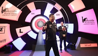 Singapore's Paul Lim, 71, becomes oldest winner of match at World Darts Championship