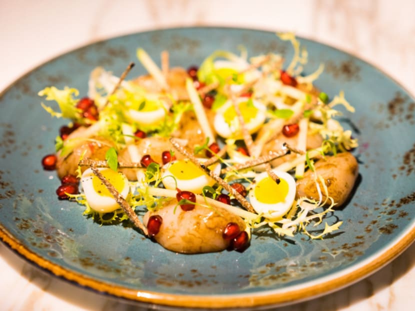 Aura Restaurant's scallops crudo with truffle and smoked quail egg is a delish example of a simple dish tricked out with premium ingredients. Aura Restaurant's scallops crudo with truffle and smoked quail egg is a delish example of a simple dish tricked out with premium ingredients.