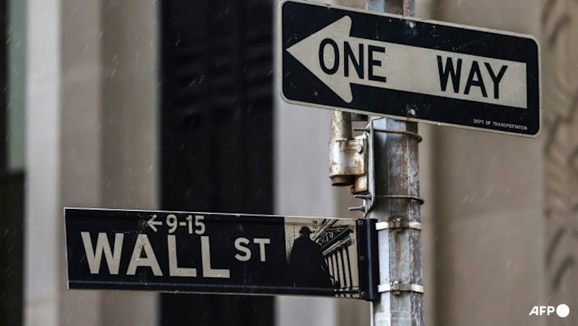 Wall St ends lower as bank CEOs warn of possible pullback, fuelling tech bubble jitters