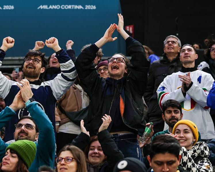 Ice hockey-Italian fans keep party going despite heavy defeat by Sweden