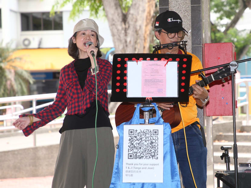 Ms Jean Liu and Mr Tang Yuen Wai busking outside Ang Mo Kio Central Market & Food Centre on April 8, 2022. Ms Jean Liu and Mr Tang Yuen Wai busking outside Ang Mo Kio Central Market & Food Centre on April 8, 2022.
