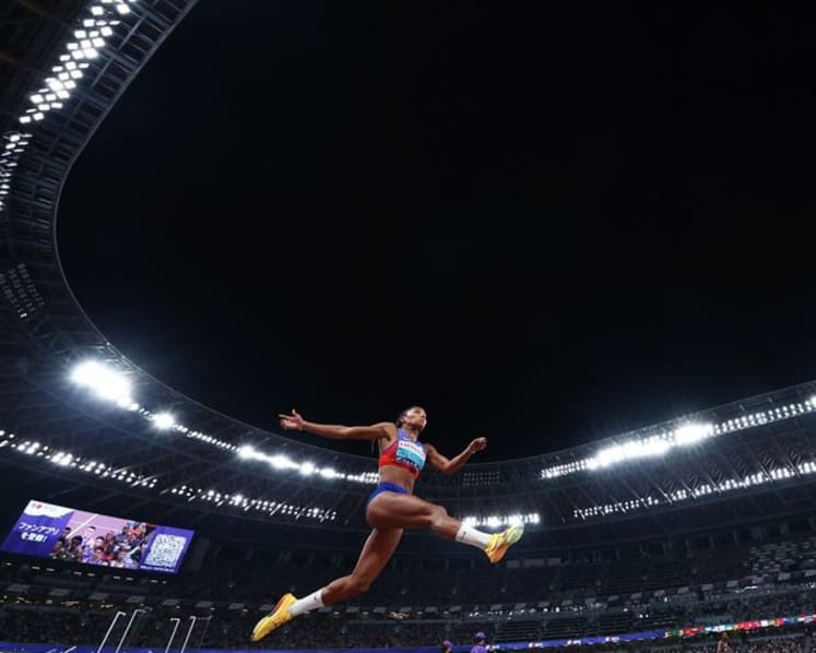 Davis-Woodhall adds world long jump title to Olympic crown