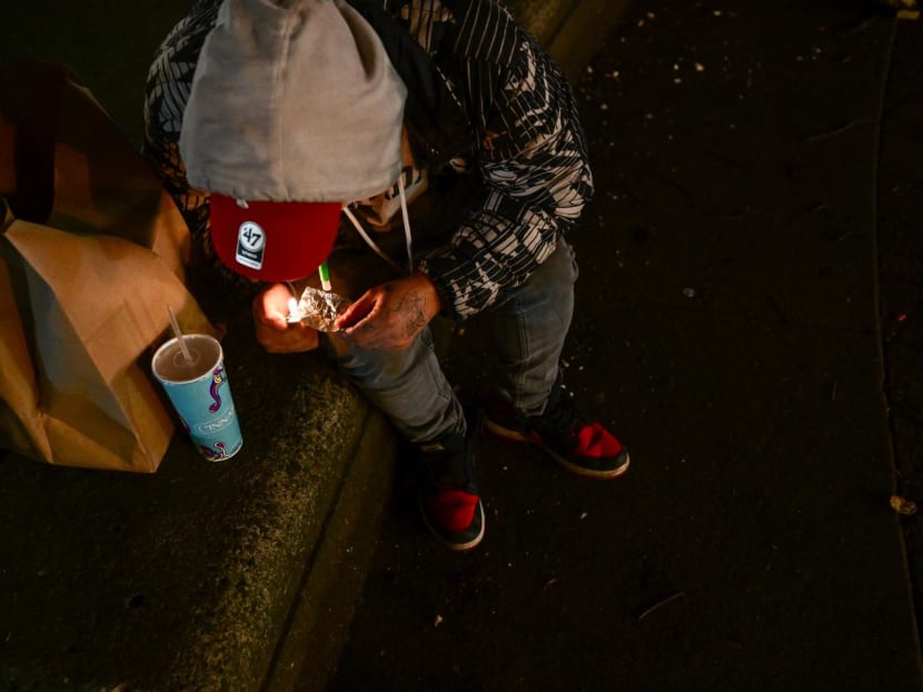 A person smokes a foil of fentanyl on Park Avenue following the decriminalisation of all drugs in downtown Portland, Oregon on Jan 23, 2024. A person smokes a foil of fentanyl on Park Avenue following the decriminalisation of all drugs in downtown Portland, Oregon on Jan 23, 2024.