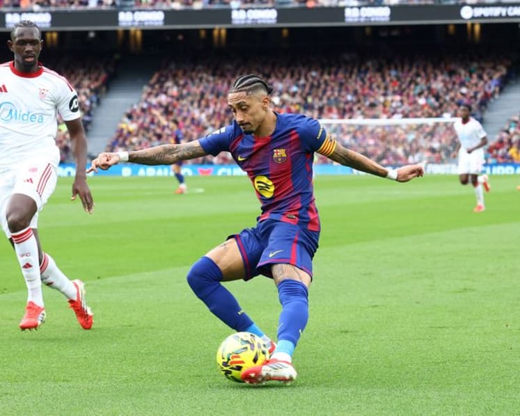 Raphinha hat-trick fires Barcelona past Sevilla to stay top