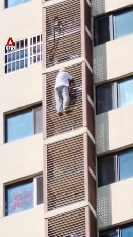Elderly woman in China rescued after climbing out of high-rise apartment