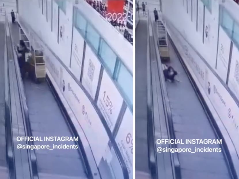 A screengrab of a viral video showing a trolley hitting two people while they were riding on a travelator at a Sheng Siong outlet. 