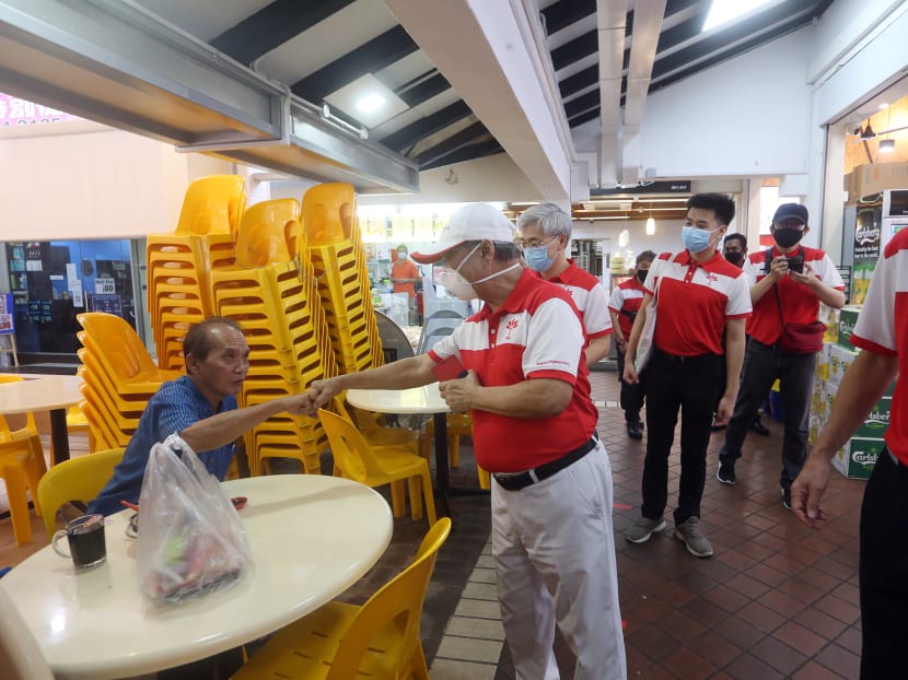 Progress Singapore Party chief Tan Cheng Bock doing a fist-bump with a patron at a coffee shop on Teck Whye Lane on June 21, 2020. Photo: Ooi Boon Keong/TODAY Progress Singapore Party chief Tan Cheng Bock doing a fist-bump with a patron at a coffee shop on Teck Whye Lane on June 21, 2020. Photo: Ooi Boon Keong/TODAY