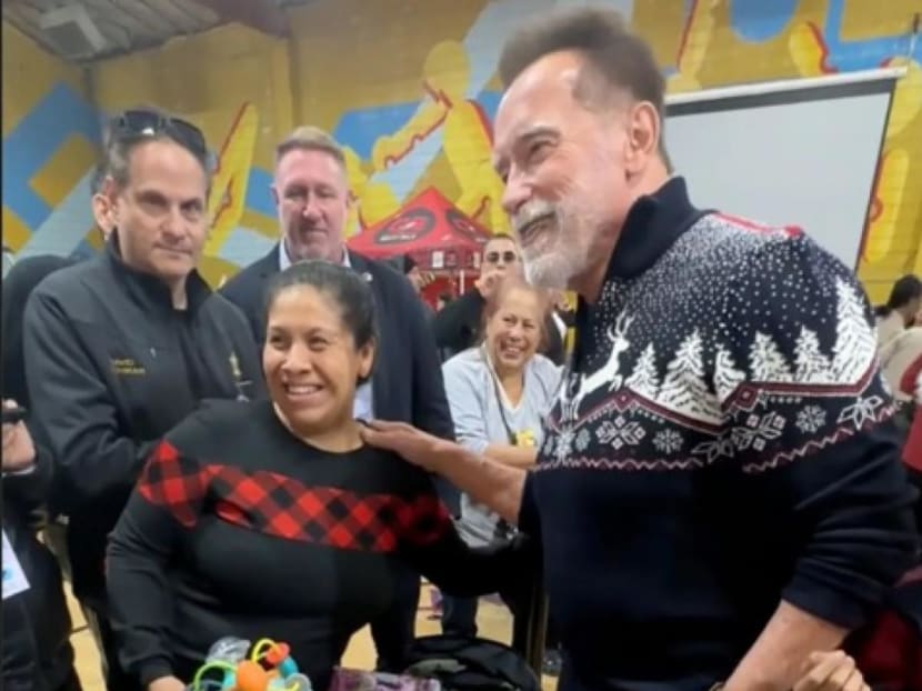 Arnold Schwarzenegger hands out Christmas gifts at LA youth centre: 'I love being able to give back'